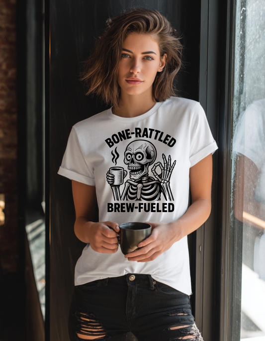 Bone-Rattled Brew-Fueled Women’s T-Shirt – Funny Skeleton Coffee Tee – Soft Relaxed Fit Graphic Top for Caffeine Lovers & Halloween Vibes